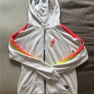 Aviator Nation white zip up hoodie with neon stripes